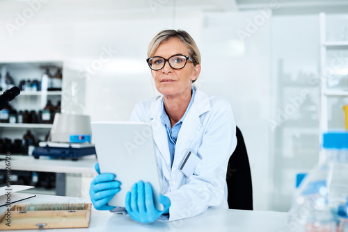 Capturing data with utmost ease. Portrait of a mature scientist using a digital tablet in a lab.