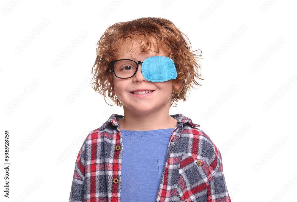 Smiling boy with eye patch on glasses against white background. Strabismus treatment Smiling boy with eye patch on glasses against white background. Strabismus treatment
