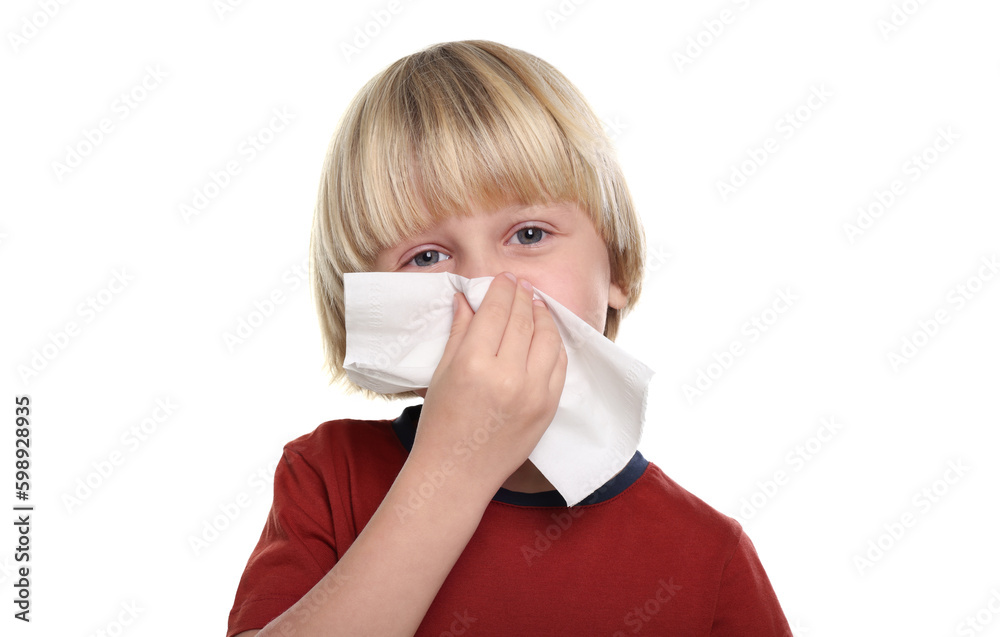 Boy blowing nose in tissue on white background. Cold symptoms Boy blowing nose in tissue on white background. Cold symptoms