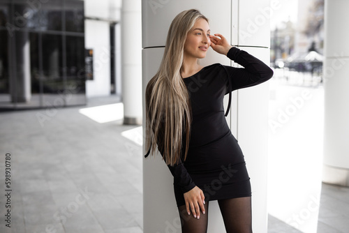 portrait of stylish beautiful woman in black dress 