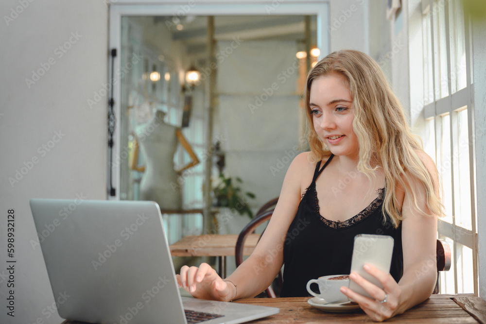 Portrait of Creative young woman working on laptop in her studio Portrait of Creative young woman working on laptop in her studio