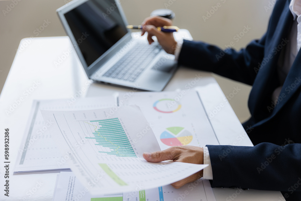 Male businessman working with calculator, business document and laptop computer notebook at room office. Male businessman working with calculator, business document and laptop computer notebook at room office.
