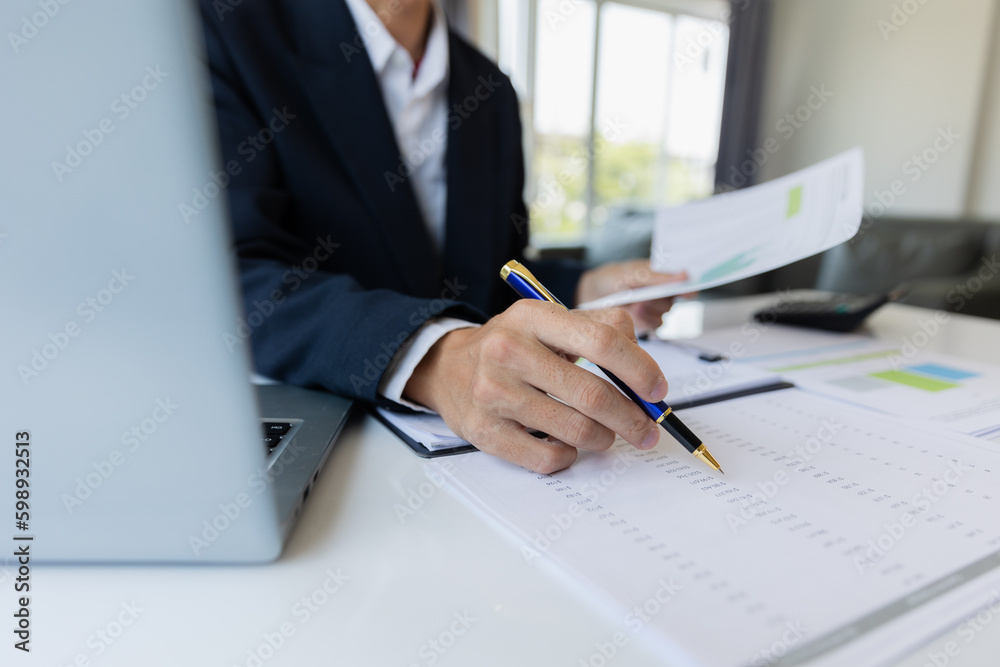 Male businessman working with calculator, business document and laptop computer notebook at room office. Male businessman working with calculator, business document and laptop computer notebook at room office.