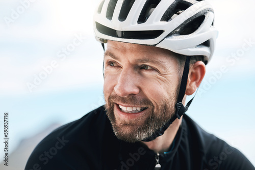 The open road is always a winner. a handsome mature man taking a break while cycling outdoors. © N F/peopleimages.com