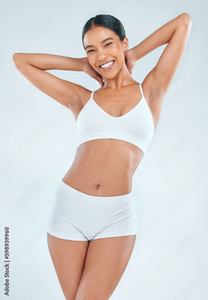 Being healthy and staying fit makes me happy. an attractive young woman standing alone in the studio and posing in her underwear.