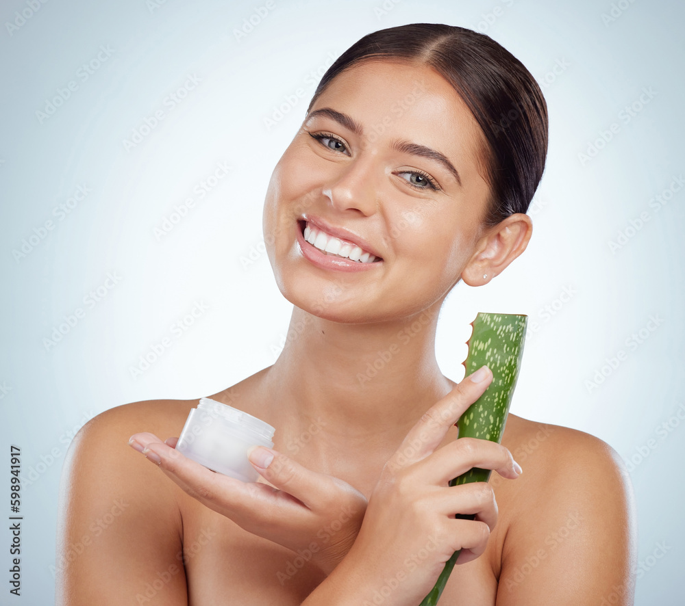 Portrait of smiling beautiful woman using aloe vera in skincare routine. Caucasian model isolated against grey studio background and posing with copyspace. Organic plants for hydration and moisture Portrait of smiling beautiful woman using aloe vera in skincare routine. Caucasian model isolated against grey studio background and posing with copyspace. Organic plants for hydration and moisture