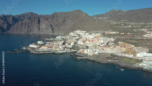 Wallpaper Mural Calm ocean view with rocky brown cliffs on coastline. Los Gigantes Tenerife.Canary Islands, Top aerial view of ocean waves splash against rocks background, Tenerife, Canary islands, Spain, Atlantic  Torontodigital.ca