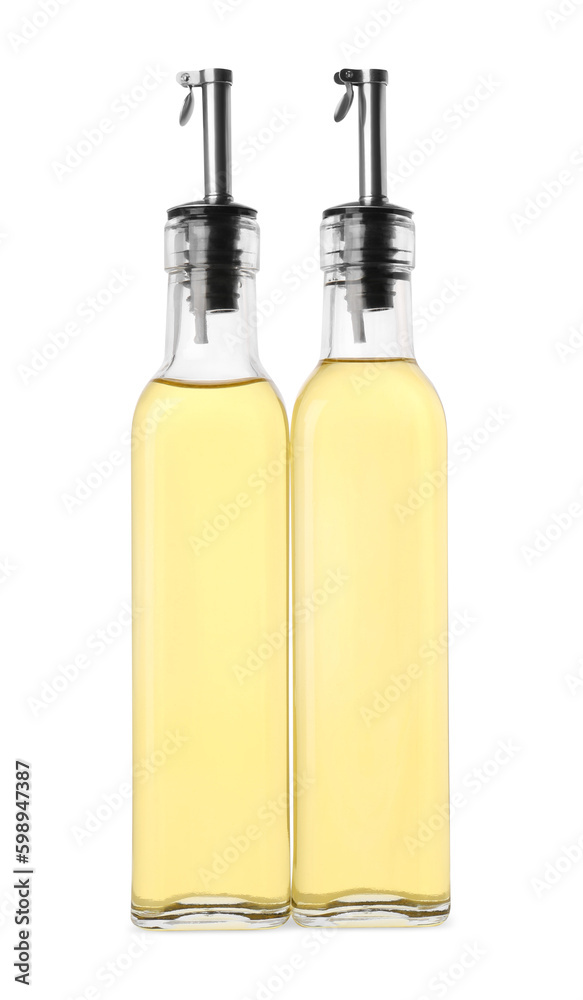 Glass bottles of cooking oil on white background Glass bottles of cooking oil on white background