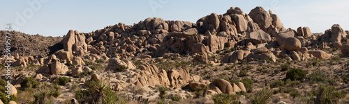 Joshua Tree NP, California, USA - December 1, 2021: Rock formations, giant bouders and iiconic Joshua Tree forests attract outdoor enthusists from around the world.