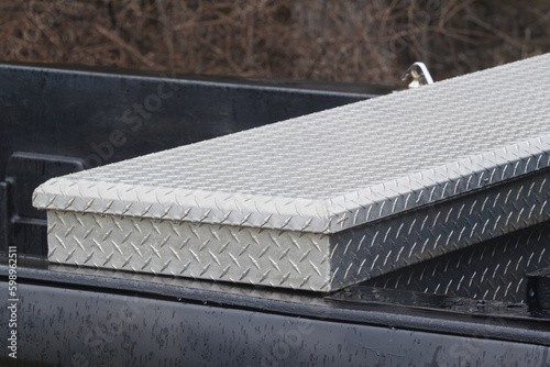 Detail view of pickup truck crossbed toolbox