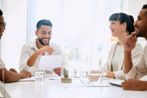 We laugh as a team, we work hard as a team. businesspeople having a meeting in a boardroom at work.