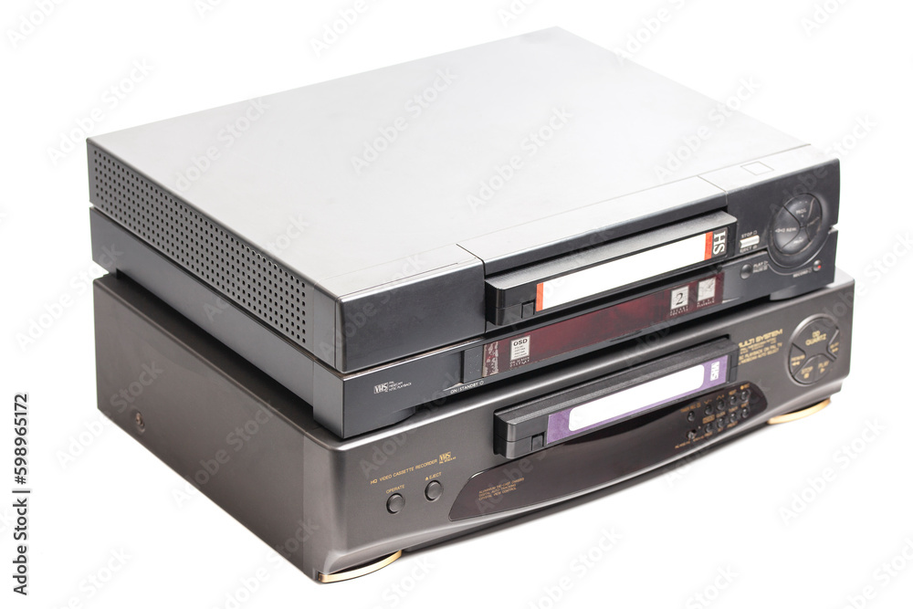 Old video cassette recorder with VHS video tape cassette isolated on white background