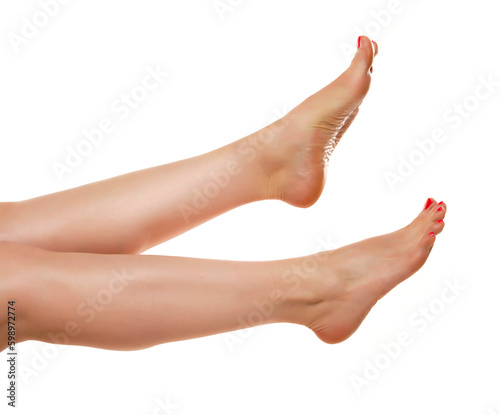 Female bare legs lifted up, isolated on white background.
