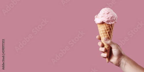 A man holds an ice cream in his hand on a pink background, empty space for text. Generative AI