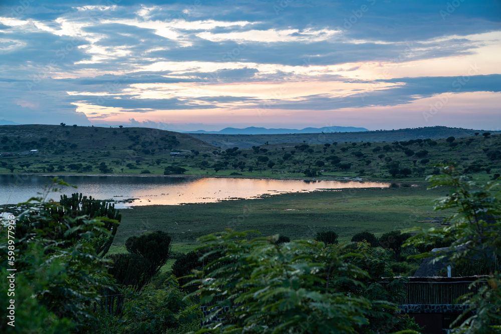 Sunset view of Lake Munyanyange in Uganda, Africa. Colorful sky after a rain storm