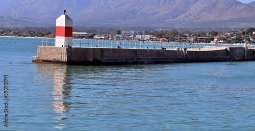Bild auf Leinwand boats on a dock at Gordon's Bay Yacht club in Cape Town South Africa