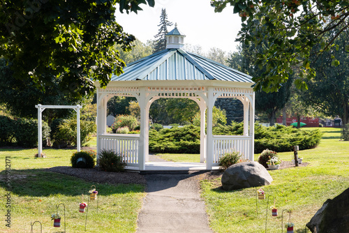 Empty gazebo at park during sunny day photo