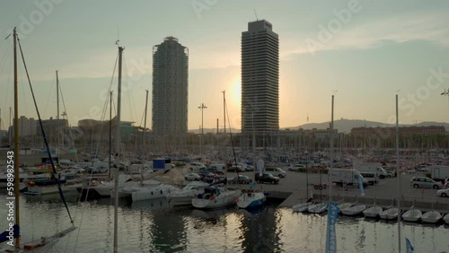 sunset over the harbor in Barcelona with Skyscrapers Vila Olimpica traveling shot photo