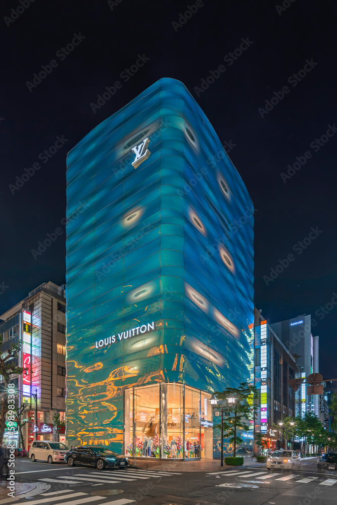 tokyo, japan - april 11 2023: Night view of the Louis Vuitton Ginza store  building designed by