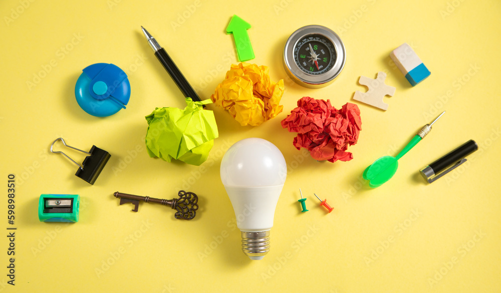 Light bulb with a business supplies. Business. Creative idea