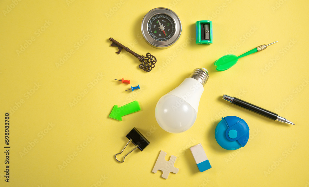 Light bulb with a business supplies. Business. Creative idea Light bulb with a business supplies. Business. Creative idea