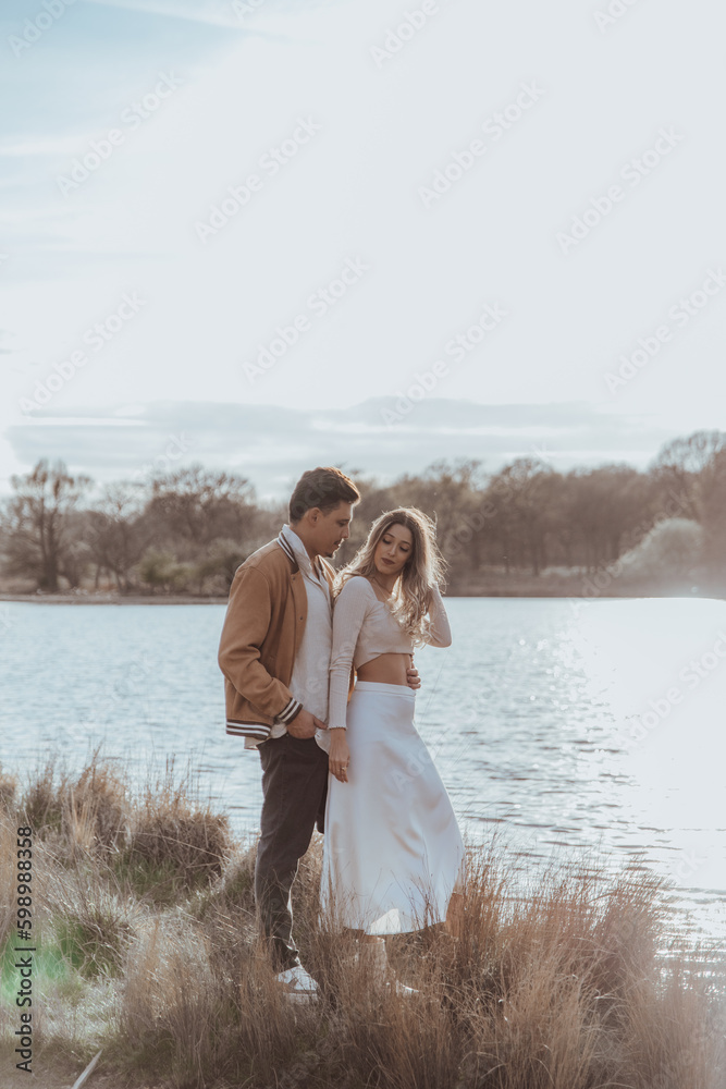 happy couple in the park on a beautiful sunny day happy couple in the park on a beautiful sunny day