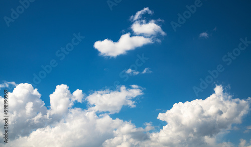 Beautiful fluffy clouds on the blue sky. Sky clouds background.
