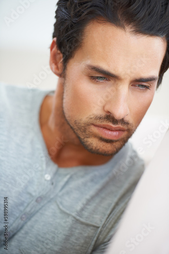 Feeling broody and moody. a handsome young man looking thoughtful.