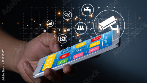 hand  using smart phone for mobile phone with smart home app