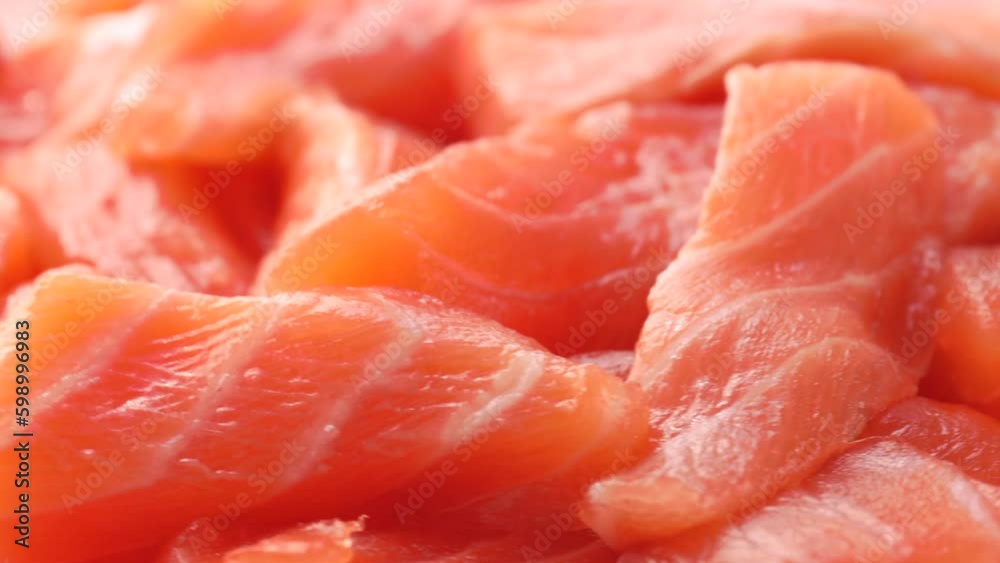 red fish slices, rotation in circle. salmon slices Turning. selective focus red fish slices, rotation in circle. salmon slices Turning. selective focus