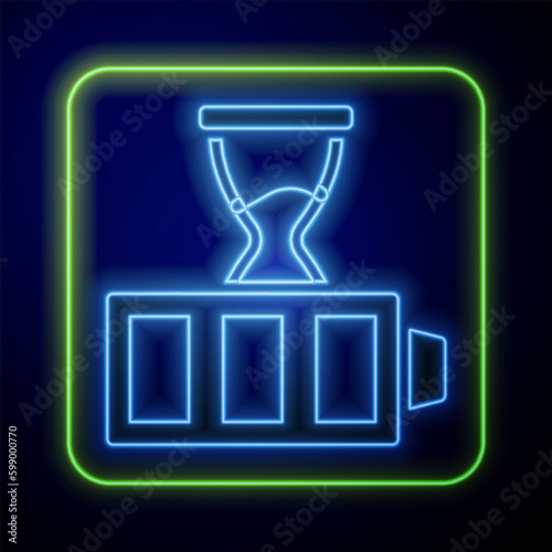 Glowing neon Battery charge level indicator icon isolated on blue background. Vector