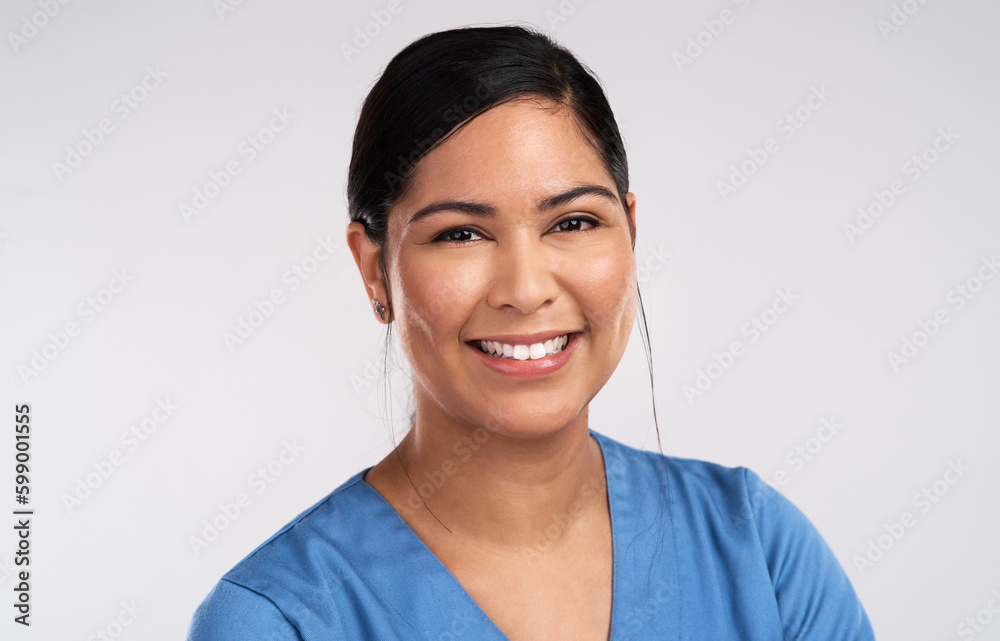 Well hold each other soon in the blackest of rooms. Portrait of a young beautiful doctor in scrubs against a white background. Well hold each other soon in the blackest of rooms. Portrait of a young beautiful doctor in scrubs against a white background.