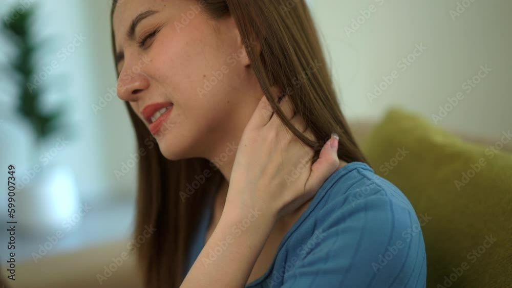 Close-up Unhappy painful moment Young woman suffering neck and shoulder pain and injury on sofa in living room. Woman body muscles problem holding painful shoulder with hand. Healthcare concept.
Close-up Unhappy painful moment Young woman suffering neck and shoulder pain and injury on sofa in living room. Woman body muscles problem holding painful shoulder with hand. Healthcare concept.