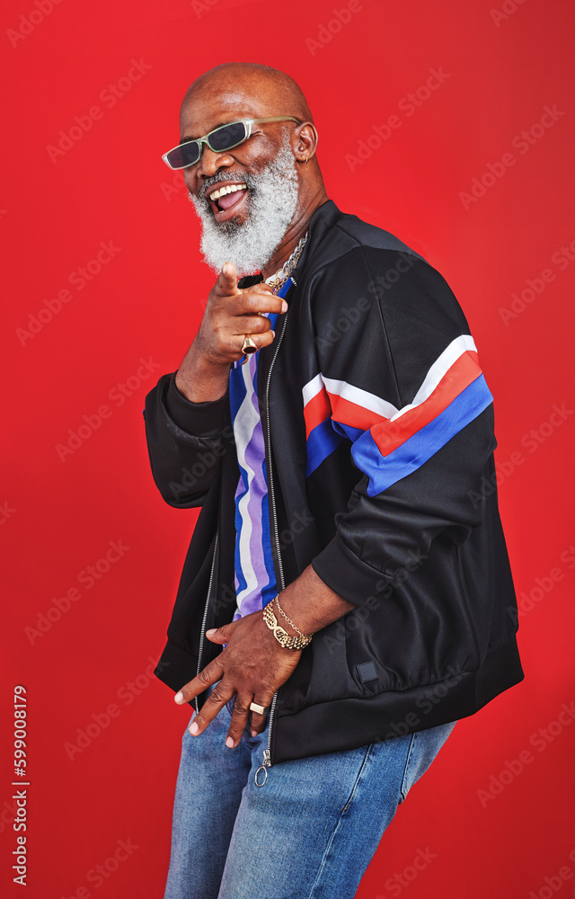 I know you like my style. Studio shot of a senior man wearing retro attire while posing against a red background. I know you like my style. Studio shot of a senior man wearing retro attire while posing against a red background.