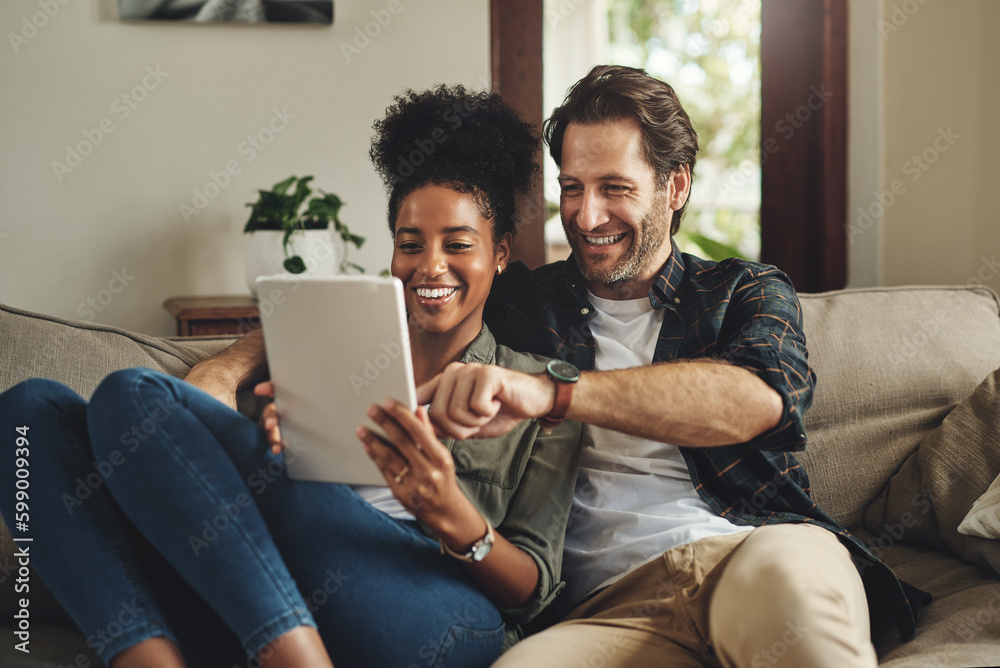 There are so many apps to choose from. a happy young couple using a digital tablet together while relaxing on a couch at home. - obrazy, fototapety, plakaty 