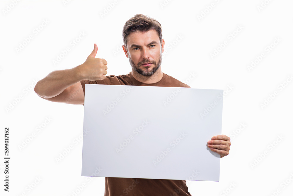 Man with thumb up and blank banner ad, on studio background. Portrait of man holding empty blank poster. Man showing blank poster gesturing thumbs up. Male presenting signboard, billboard or banner. Man with thumb up and blank banner ad, on studio background. Portrait of man holding empty blank poster. Man showing blank poster gesturing thumbs up. Male presenting signboard, billboard or banner.