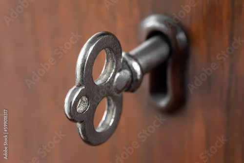 Old key. Old key in the keyhole. Key for the lock. Shallow depth of field. Selective focus