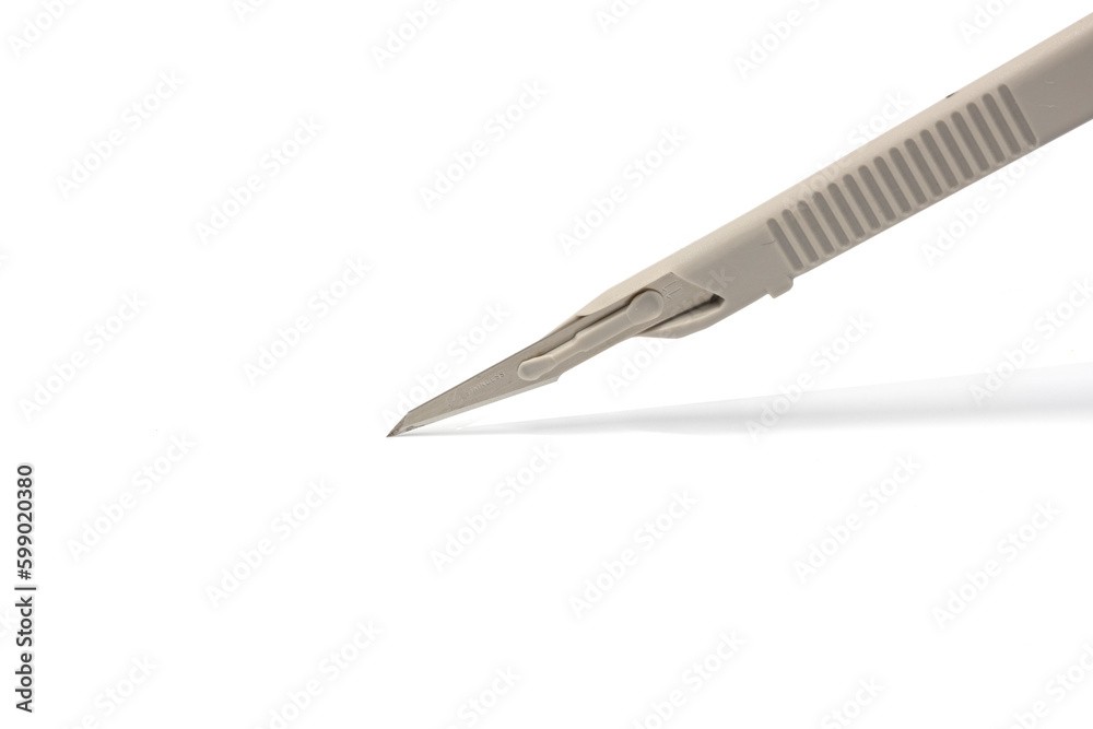 Disposable surgical scalpel isolated on white Disposable surgical scalpel isolated on white