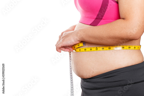 Fat woman measuring her stomach isolated on white background. Overweight, Obesity. Woman diet lifestyle concept photo