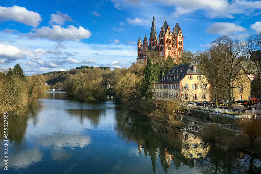 Scenic view of Limburg Cathedral, Germany and river Lahn against blue sky with clouds