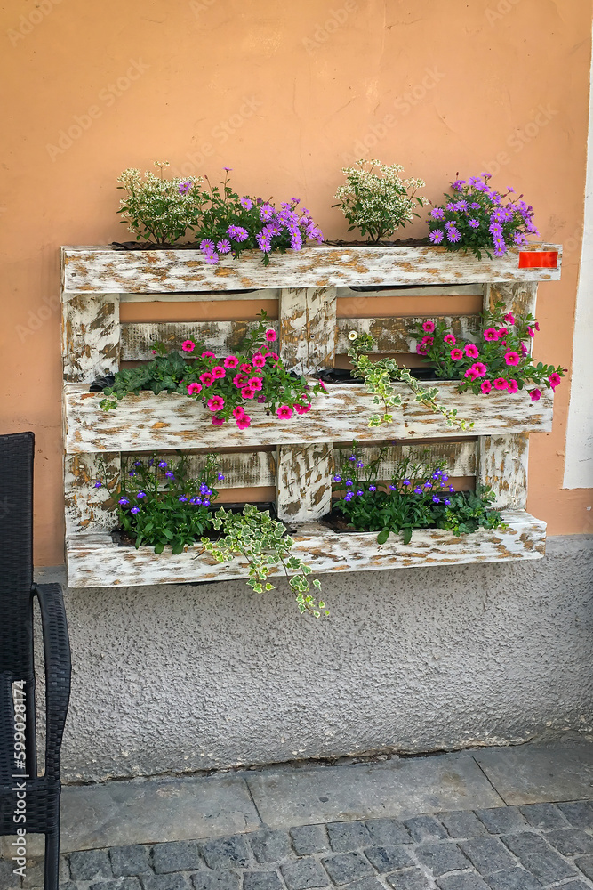 Creative flower decoration in a refurbished Euro pallet