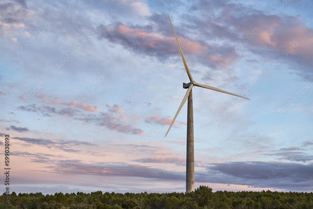 wind energy, renewable energies ecology a windmill in the countryside at dusk wind energy, renewable energies ecology a windmill in the countryside at dusk