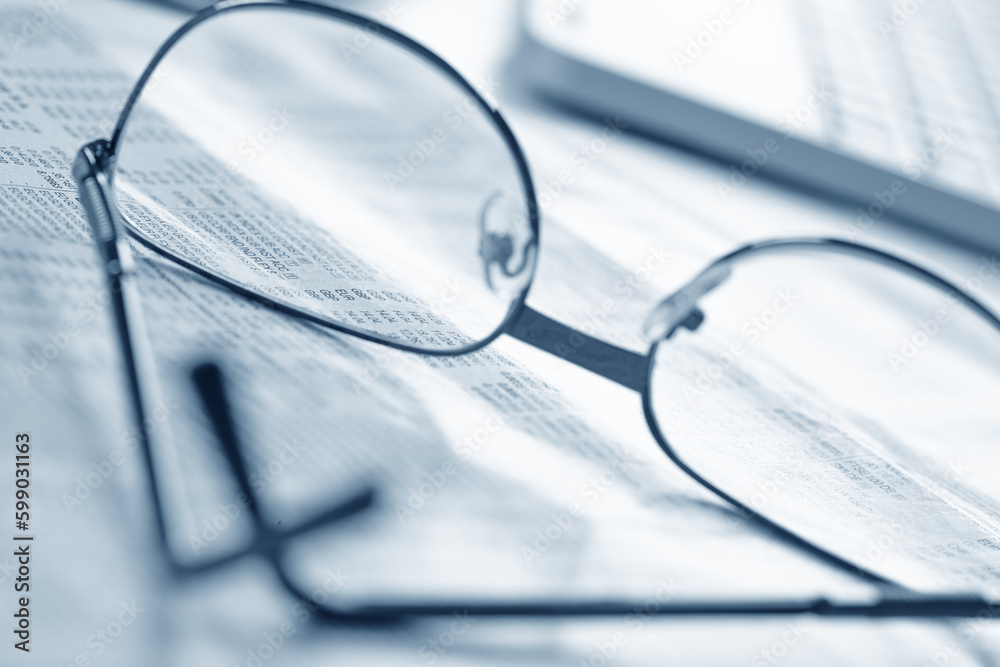 Clipboard and glasses on office table Clipboard and glasses on office table