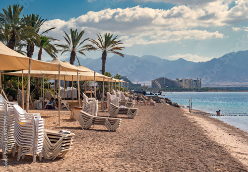 Morning on sandy beach of the Red Sea near Eilat - famous tourist resort in I...
