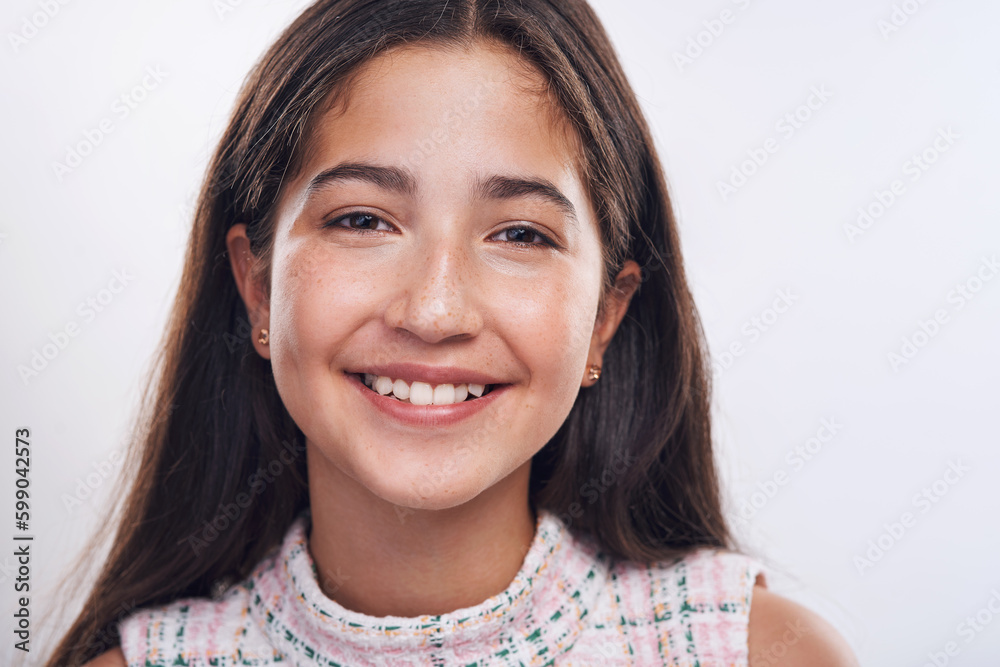 There are always reasons to smile. Cropped portrait of an attractive teenage girl standing alone against a white background in the studio. There are always reasons to smile. Cropped portrait of an attractive teenage girl standing alone against a white background in the studio.