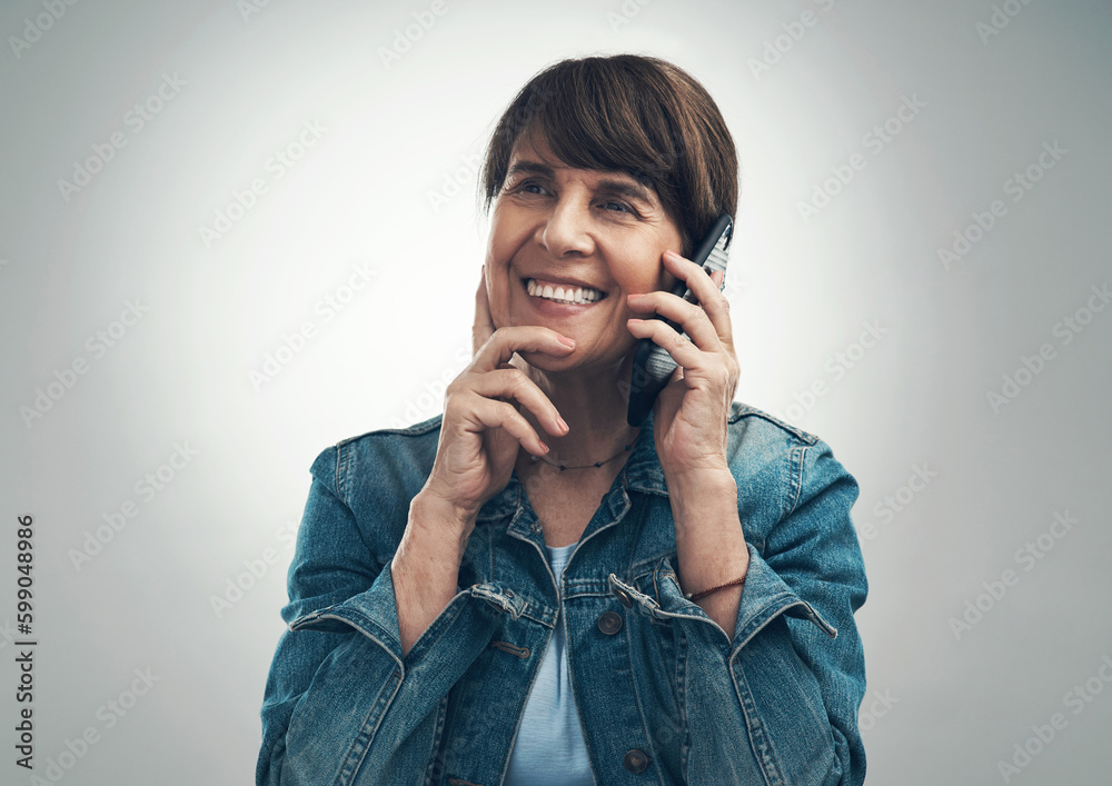 Now that sounds like a plan. Studio shot of a senior woman talking on a cellphone against a grey background. Now that sounds like a plan. Studio shot of a senior woman talking on a cellphone against a grey background.
