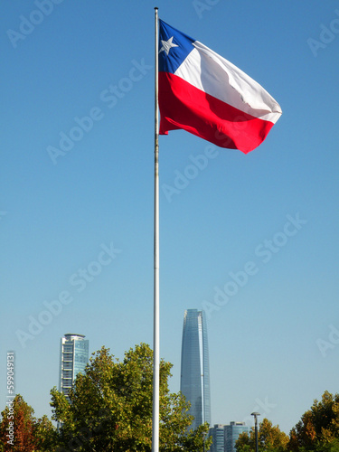 Chilean flag in Bicentennial Park and business buildings, Santiago, Chile photo