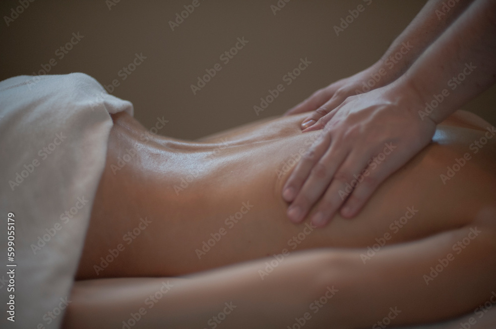 Photographs of massage and bodywork. Male therapist working on female client. Photographs of massage and bodywork. Male therapist working on female client.