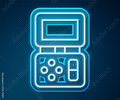 Glowing neon line Portable tetris electronic game icon isolated on blue background. Vintage style pocket brick game. Interactive playing device. Vector