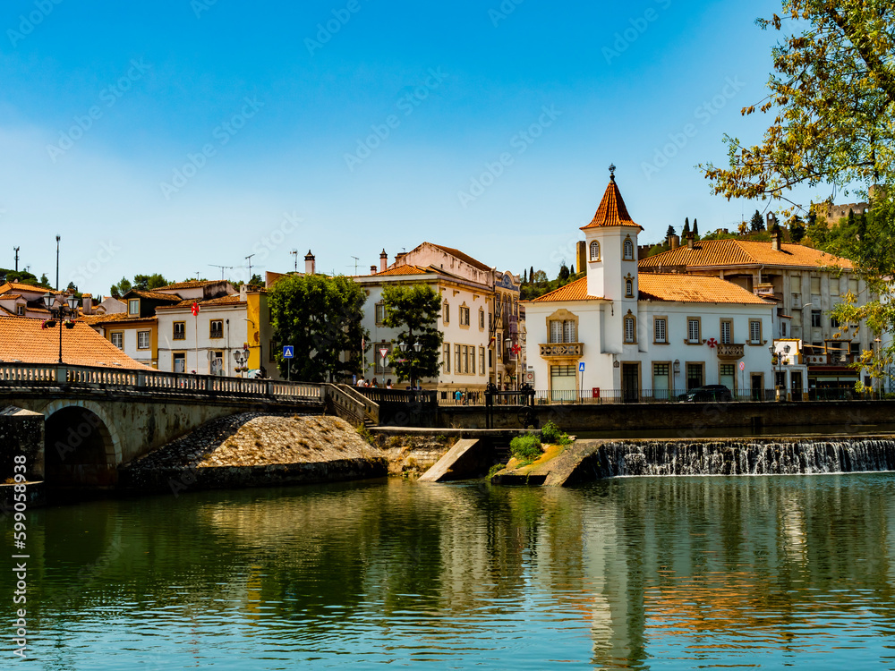 Stunning skyline of Tomar reflected in Nabao river, Santarem District, Portugal